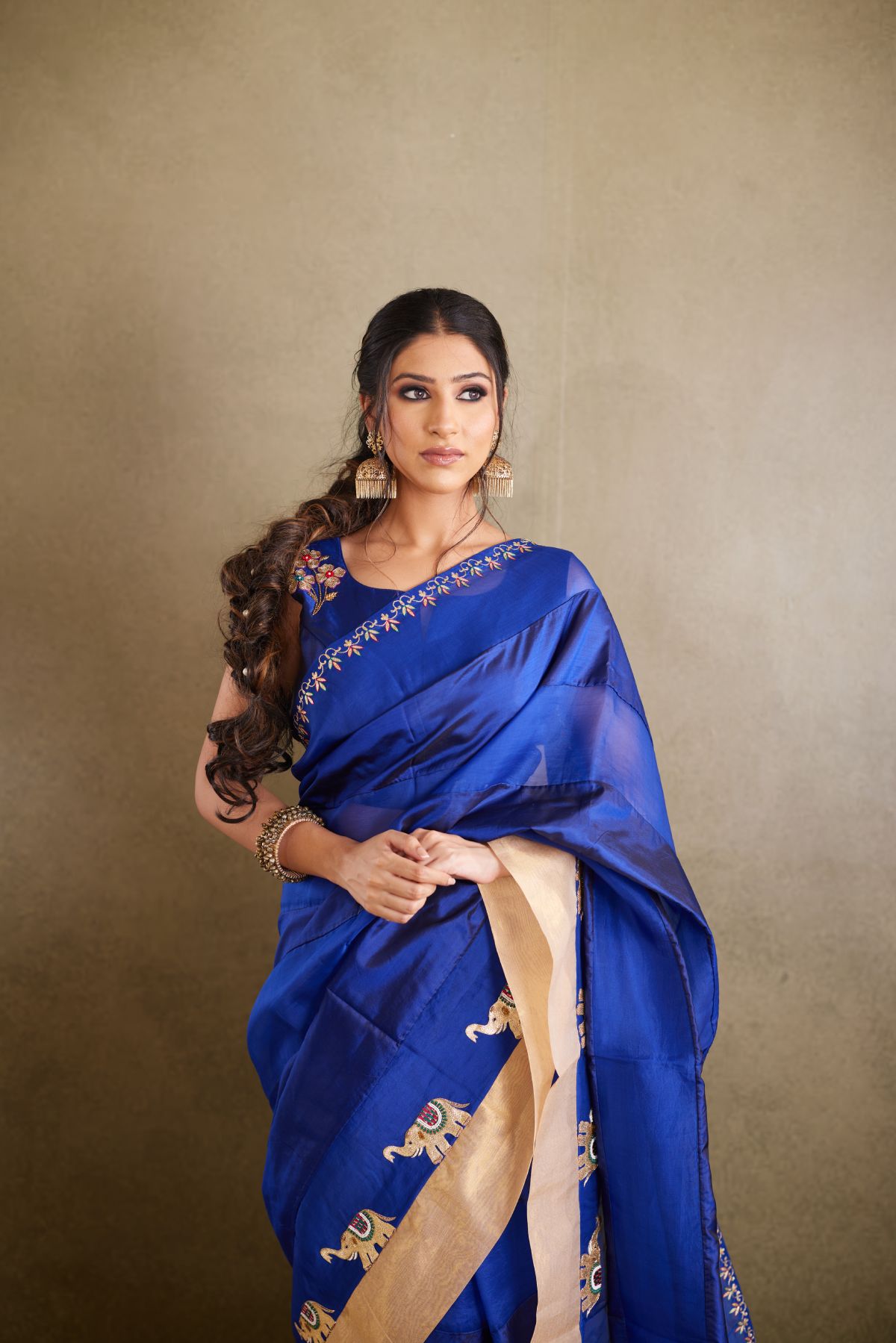 The Royal Azure - Blue Organza & Silk Saree with Hand-Embroidered Elephants and Golden Palla