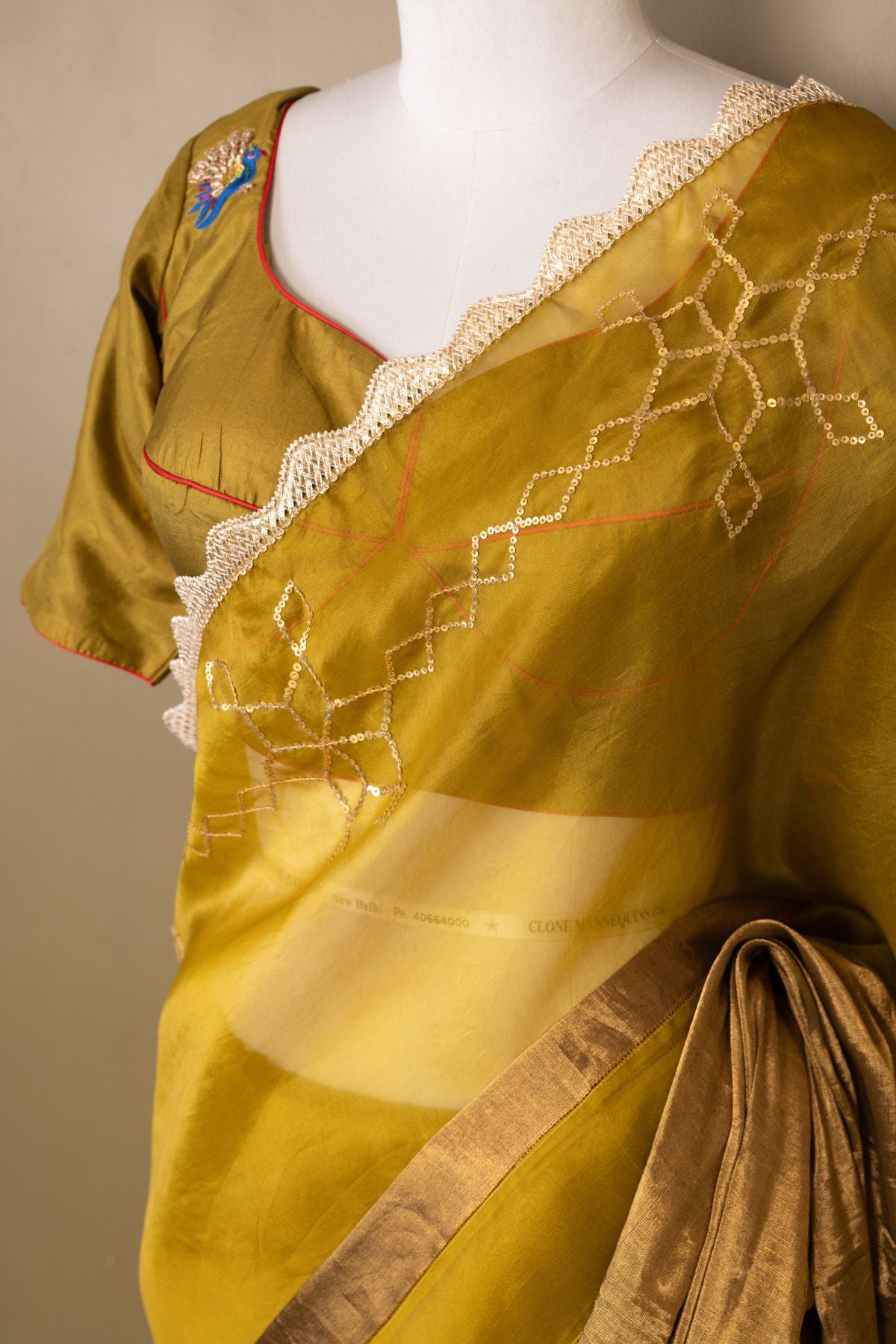 The Olive Majesty - Organza & Tissue Saree with Sequined Borders and Peacock Embroidery